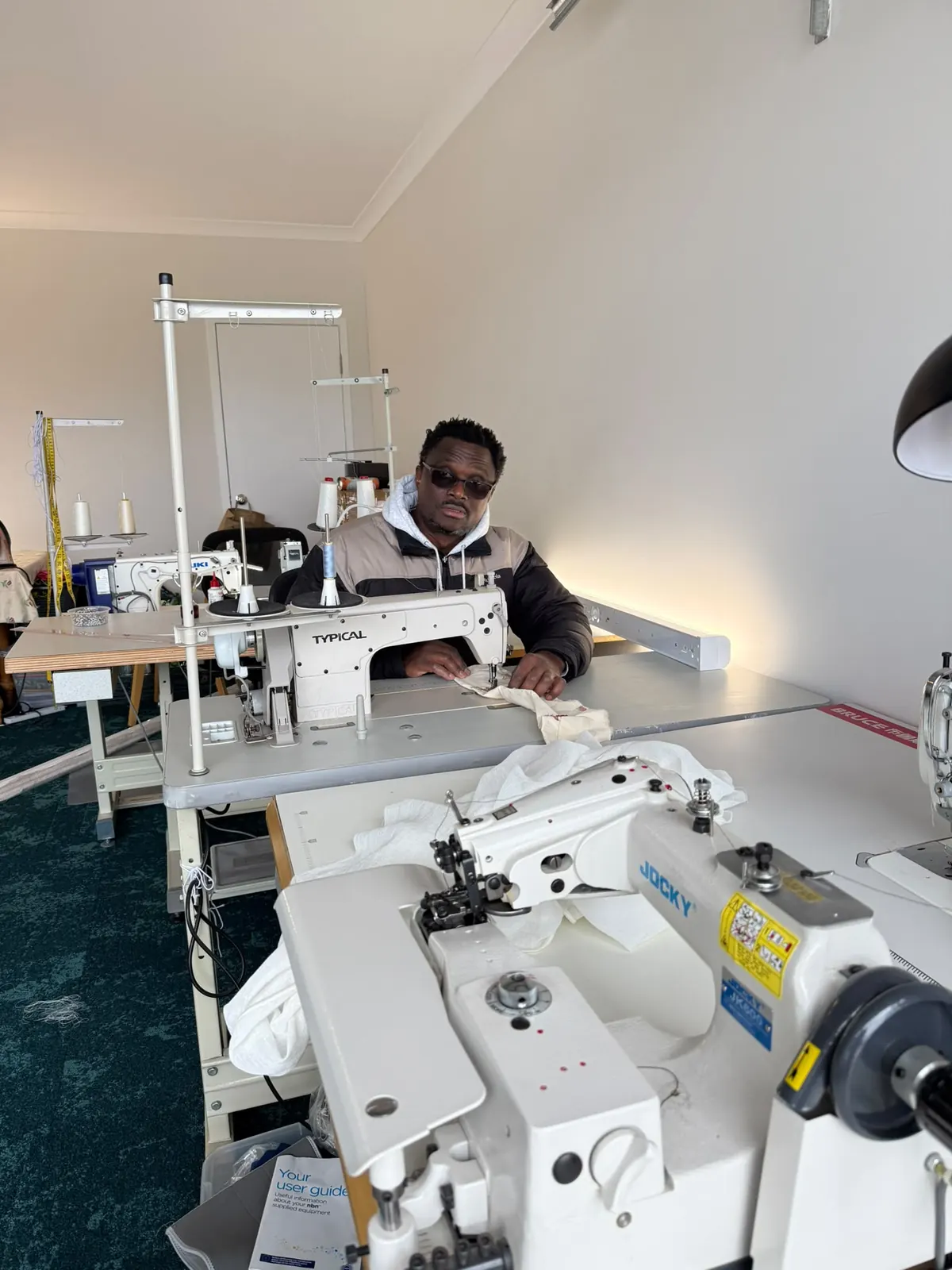Industrial sewing machines in use