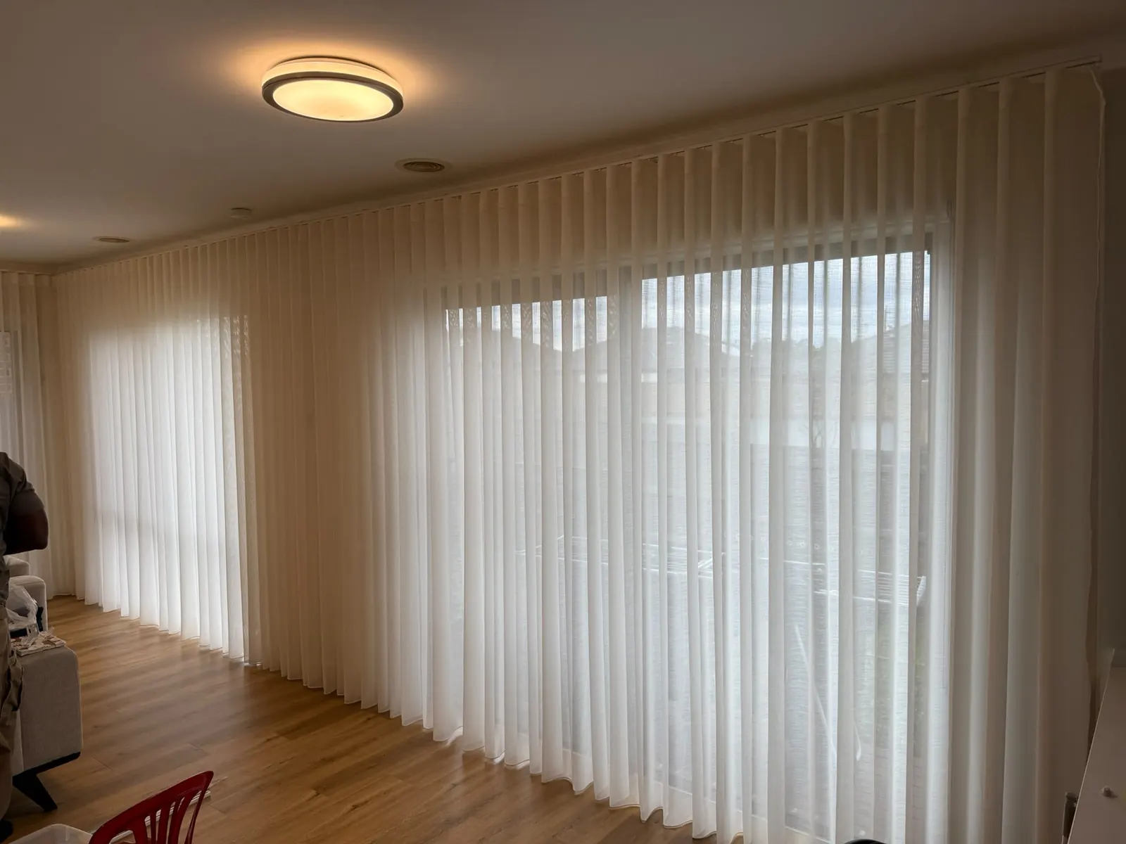 Wide curtain installation in a living room