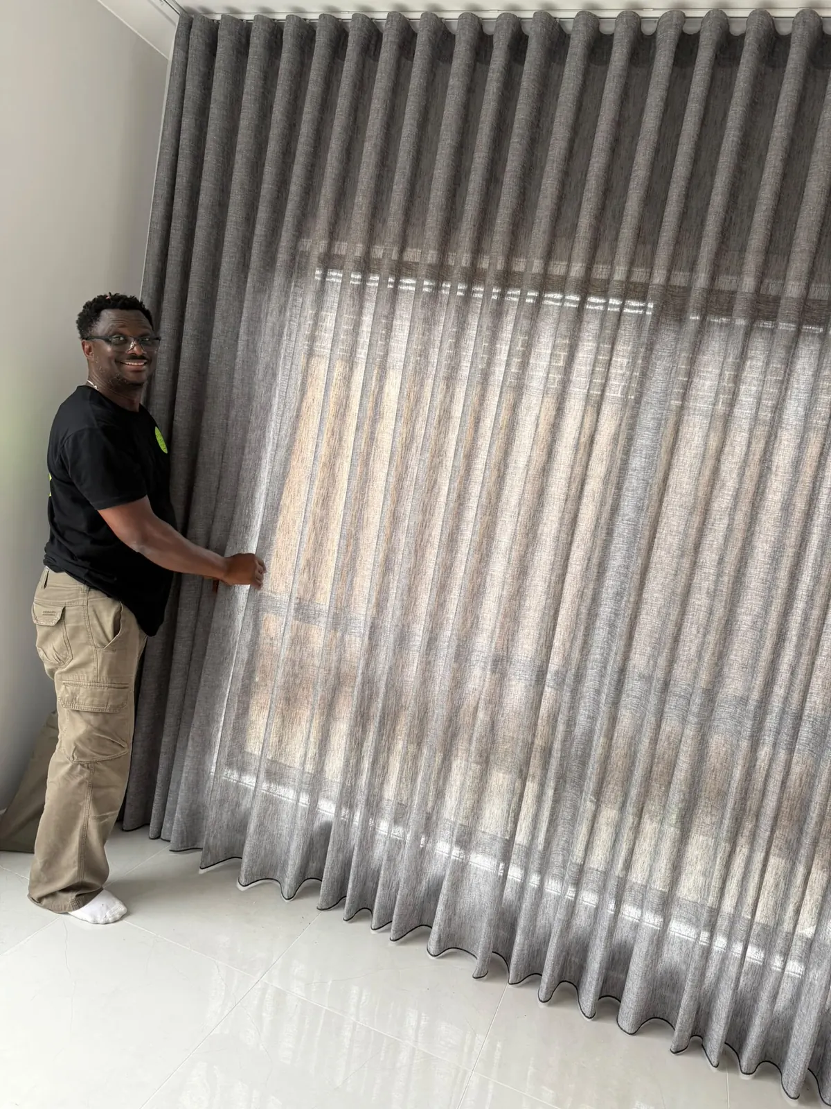 Checking the hang of the curtains