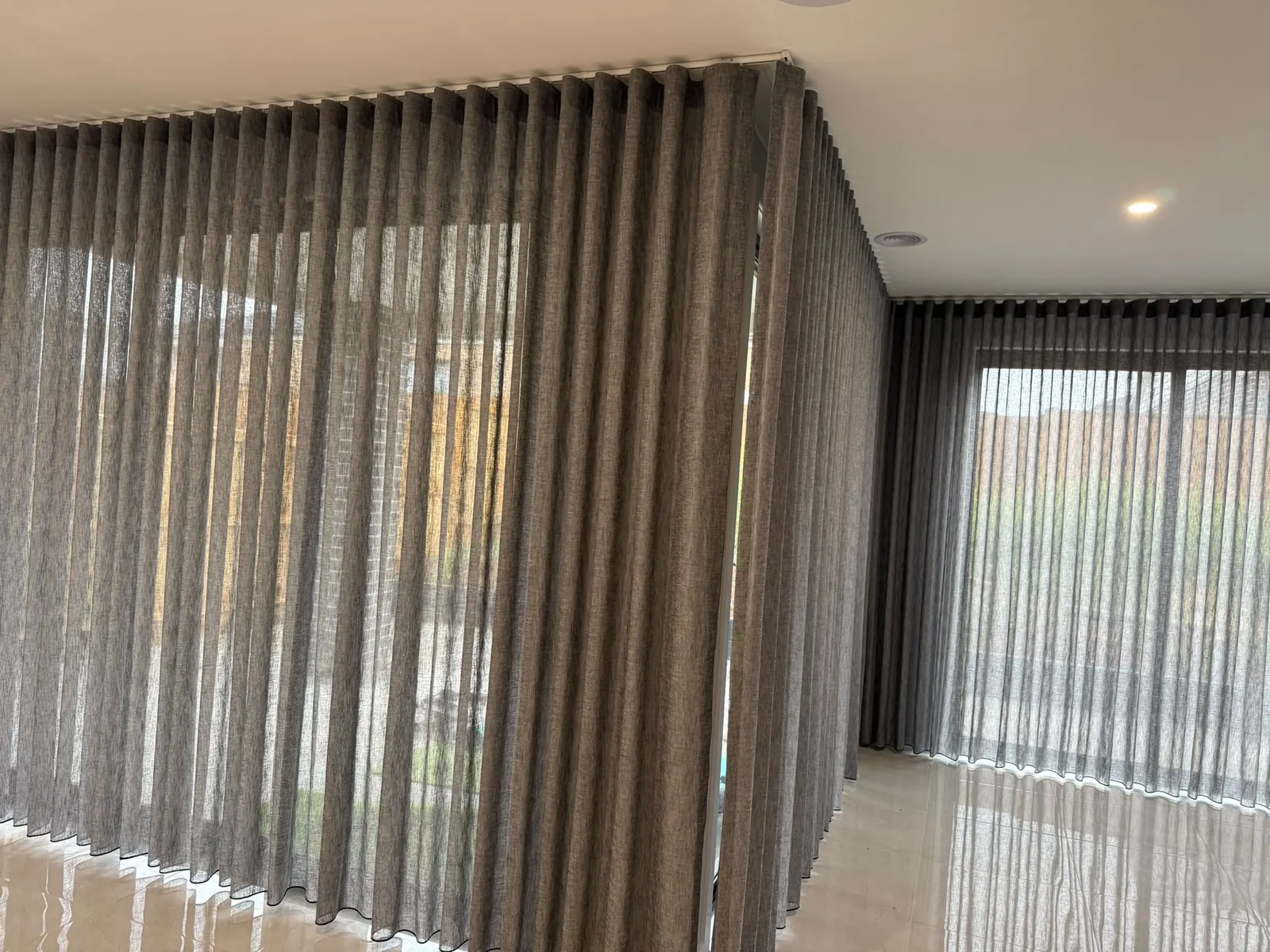 Real layered curtains made and fitted for a living room