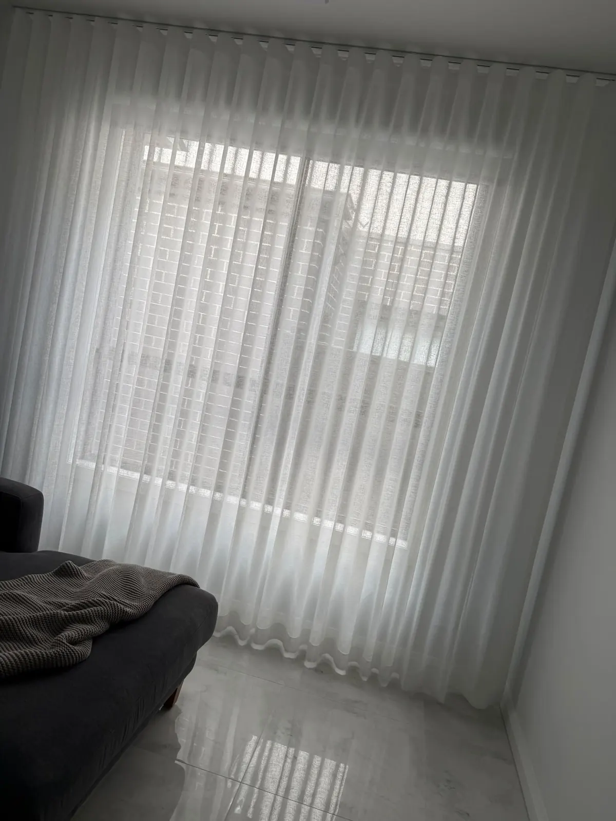 Soft curtains over a bedroom window