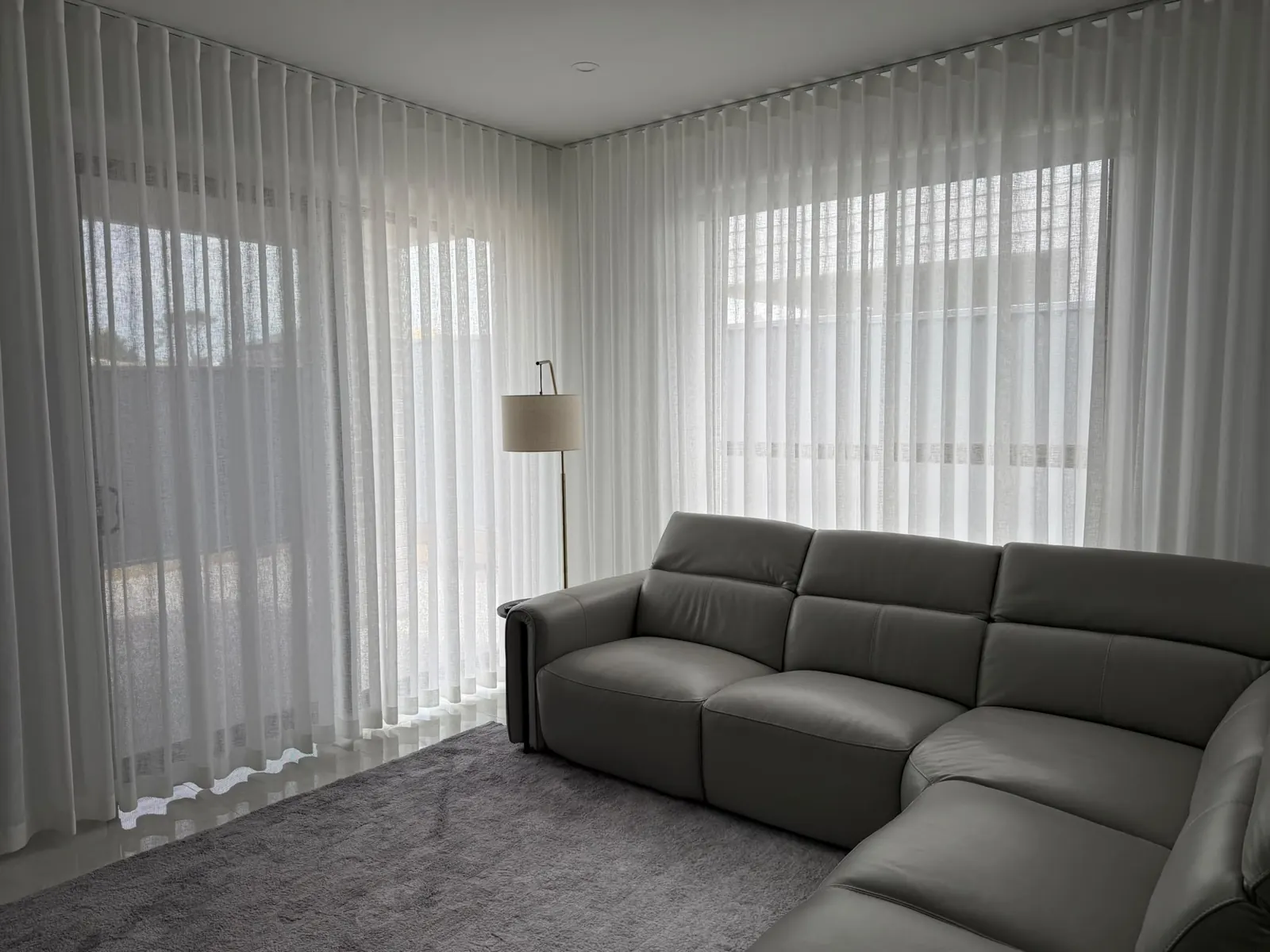 Sheer curtains in a finished living room